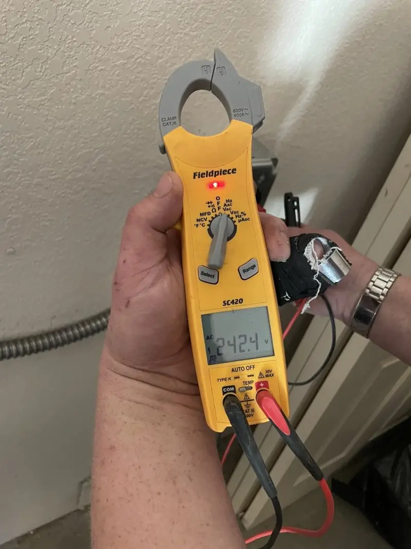 Voltage testing with clamp meter during Ceiling Fan Installation in Fort Pierce North